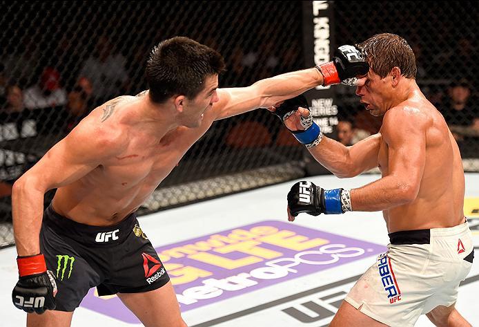 INGLEWOOD, CA - JUNE 04: Dominick Cruz throws a left punch at Urijah Faber in their UFC bantamweight championship bout during the UFC 199 event at The Forum on June 4, 2016 in Inglewood, California. (Photo by Josh Hedges/Zuffa LLC/Zuffa LLC via Getty Ima