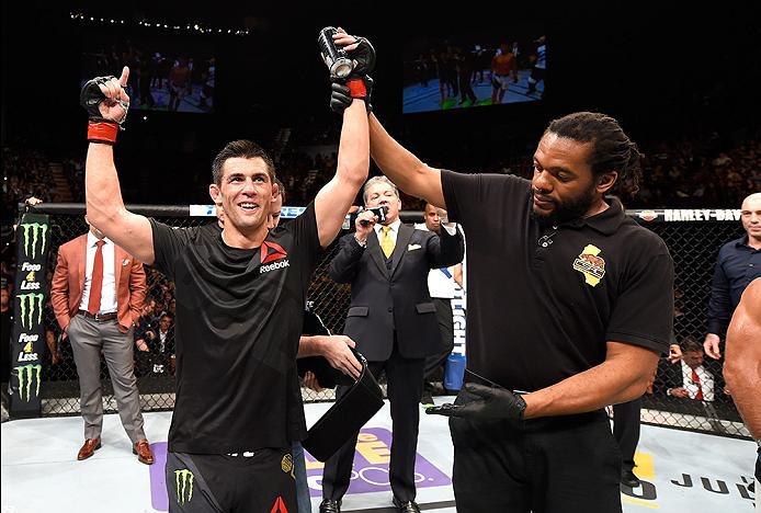 INGLEWOOD, CA - JUNE 04: Dominick Cruz celebrates after defeating Urijah Faber by unanimous decision in their UFC bantamweight championship bout during the UFC 199 event at The Forum on June 4, 2016 in Inglewood, California. (Photo by Josh Hedges/Zuffa