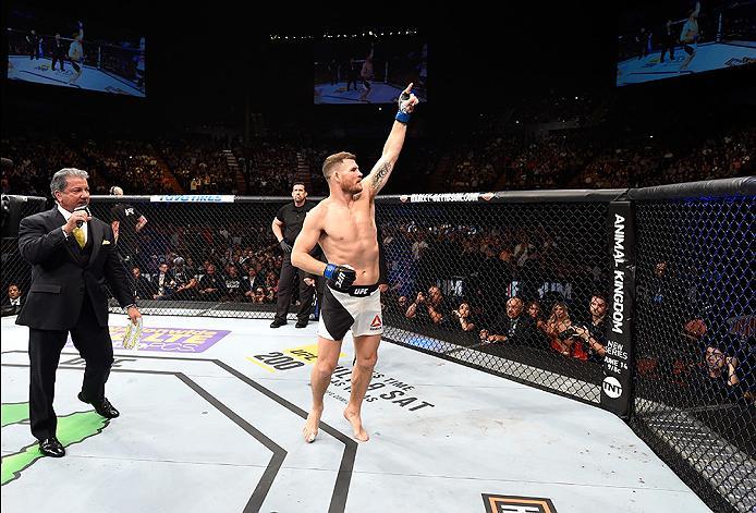 INGLEWOOD, CA - JUNE 04: Michael Bisping of England celebrates after his first round knockout win against Luke Rockhold in their UFC middleweight championship bout during the UFC 199 event at The Forum on June 4, 2016 in Inglewood, California. (Photo by