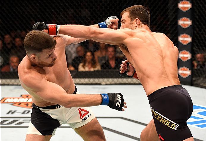 INGLEWOOD, CA - JUNE 04: Luke Rockhold throws a left punch at Michael Bisping of England in their UFC middleweight championship bout during the UFC 199 event at The Forum on June 4, 2016 in Inglewood, California. (Photo by Josh Hedges/Zuffa LLC/Zuffa LL