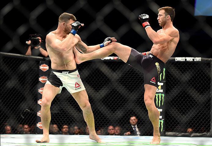 INGLEWOOD, CA - JUNE 04: Luke Rockhold kicks Michael Bisping of England in their UFC middleweight championship bout during the UFC 199 event at The Forum on June 4, 2016 in Inglewood, California. (Photo by Harry How/Zuffa LLC/Zuffa LLC via Getty Images)
