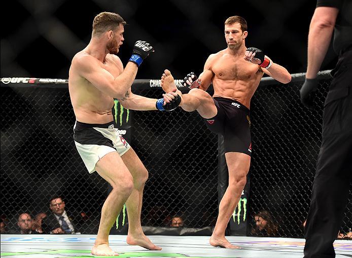 INGLEWOOD, CA - JUNE 04: Luke Rockhold kicks Michael Bisping of England in their UFC middleweight championship bout during the UFC 199 event at The Forum on June 4, 2016 in Inglewood, California. (Photo by Harry How/Zuffa LLC/Zuffa LLC via Getty Images)