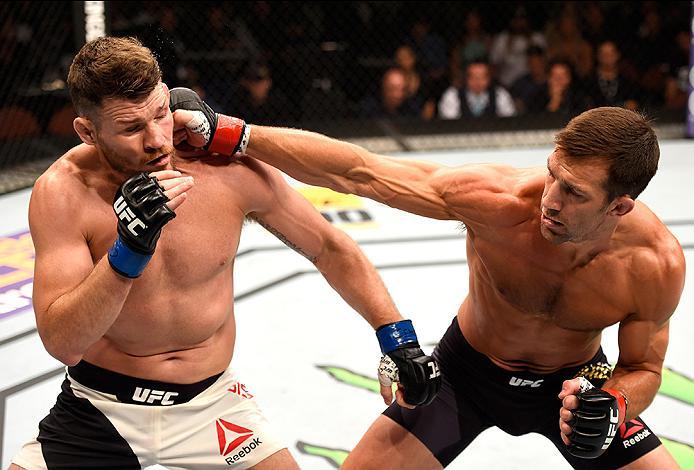 INGLEWOOD, CA - JUNE 04: Luke Rockhold throws a right punch against Michael Bisping of England in their UFC middleweight championship bout during the UFC 199 event at The Forum on June 4, 2016 in Inglewood, California. (Photo by Josh Hedges/Zuffa LLC/Zuf