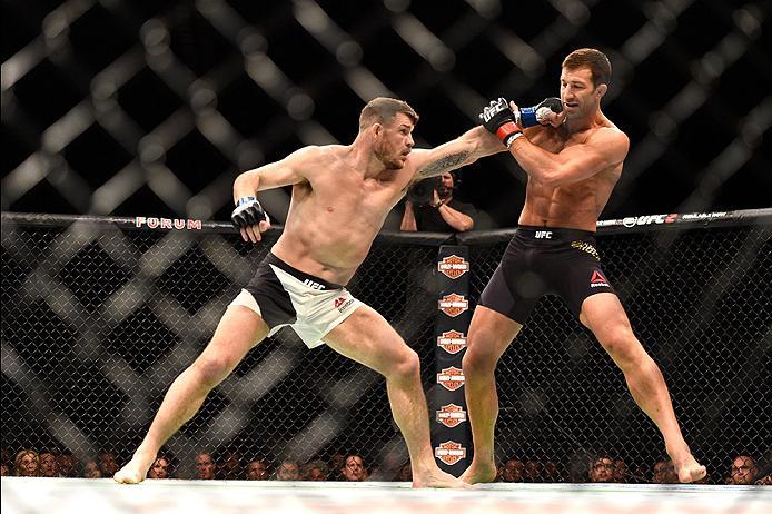 INGLEWOOD, CA - JUNE 04: Michael Bisping of England throws a left at Luke Rockhold during the UFC 199 event at The Forum on June 4, 2016 in Inglewood, California. (Photo by Jeff Bottari/Zuffa LLC/Zuffa LLC via Getty Images)