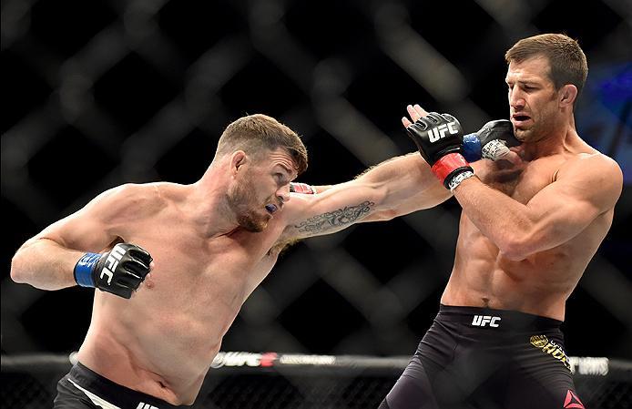 INGLEWOOD, CA - JUNE 04: Michael Bisping of England throws a left punch at Luke Rockhold in their UFC middleweight championship bout during the UFC 199 event at The Forum on June 4, 2016 in Inglewood, California. (Photo by Harry How/Zuffa LLC/Zuffa LLC v