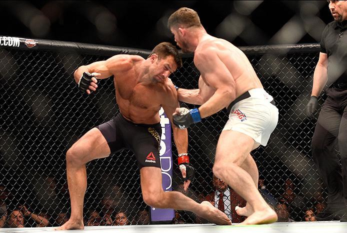 INGLEWOOD, CA - JUNE 04: Michael Bisping of England punches Luke Rockhold during the UFC 199 event at The Forum on June 4, 2016 in Inglewood, California. (Photo by Jeff Bottari/Zuffa LLC/Zuffa LLC via Getty Images)