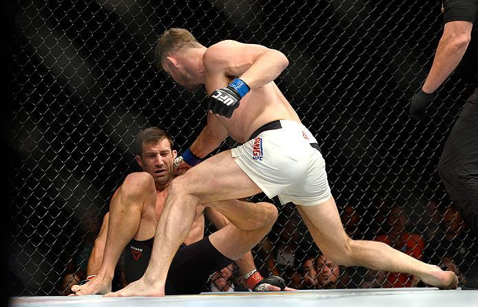 INGLEWOOD, CA - JUNE 04: Michael Bisping of England throws a right punch at Luke Rockhold during the UFC 199 event at The Forum on June 4, 2016 in Inglewood, California. (Photo by Brandon Magnus/Zuffa LLC/Zuffa LLC via Getty Images)