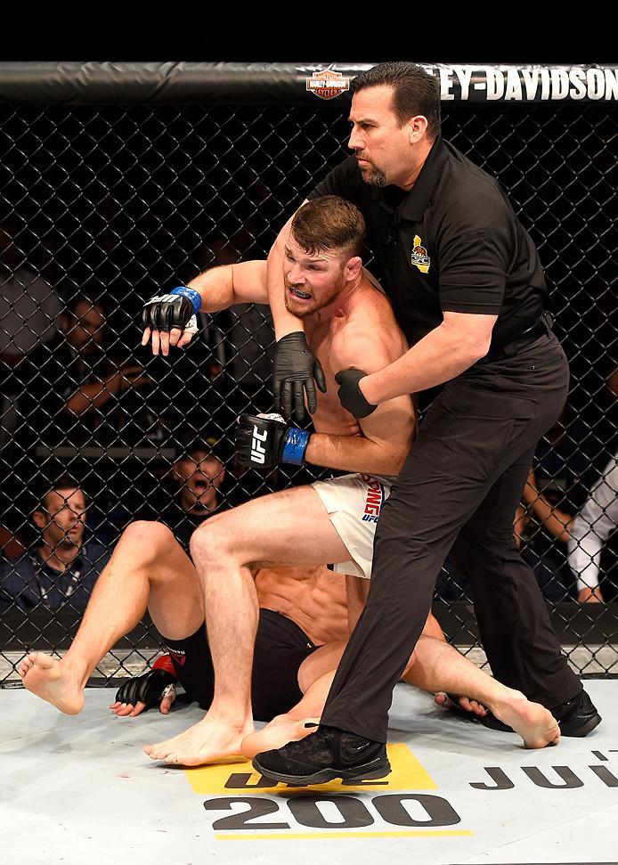 INGLEWOOD, CA - JUNE 04: Michael Bisping of England celebrates after his first round knockout win against Luke Rockhold in their UFC middleweight championship bout during the UFC 199 event at The Forum on June 4, 2016 in Inglewood, California. (Photo by