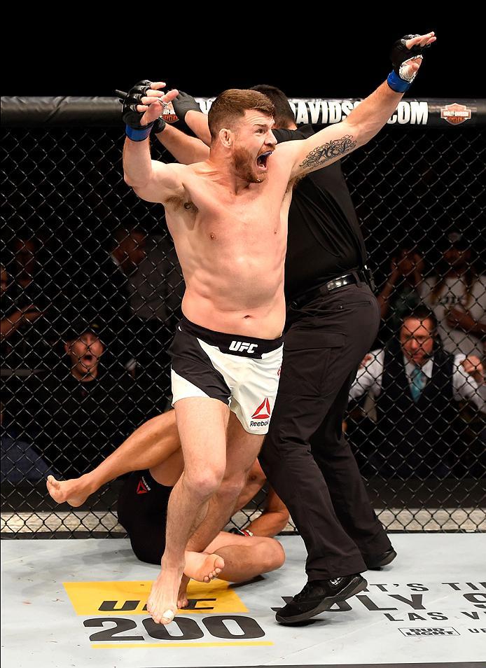 INGLEWOOD, CA - JUNE 04: Michael Bisping of England celebrates after his first round knockout win against Luke Rockhold in their UFC middleweight championship bout during the UFC 199 event at The Forum on June 4, 2016 in Inglewood, California. (Photo by