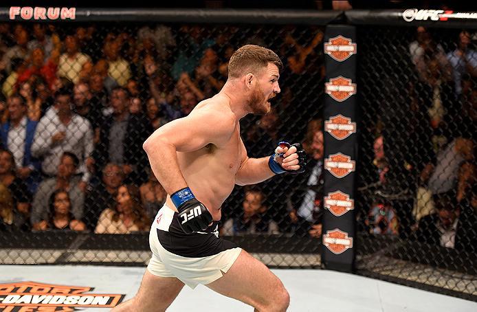 INGLEWOOD, CA - JUNE 04: Michael Bisping of England celebrates after his first round knockout win against Luke Rockhold in their UFC middleweight championship bout during the UFC 199 event at The Forum on June 4, 2016 in Inglewood, California. (Photo by