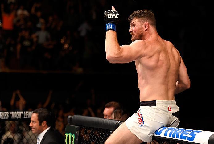INGLEWOOD, CA - JUNE 04: Michael Bisping of England celebrates after his first round knockout win against Luke Rockhold in their UFC middleweight championship bout during the UFC 199 event at The Forum on June 4, 2016 in Inglewood, California. (Photo by