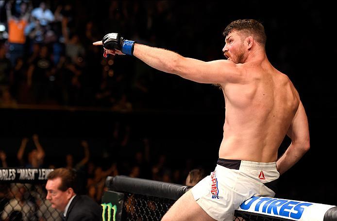 INGLEWOOD, CA - JUNE 04: Michael Bisping of England celebrates after his first round knockout win against Luke Rockhold in their UFC middleweight championship bout during the UFC 199 event at The Forum on June 4, 2016 in Inglewood, California. (Photo by