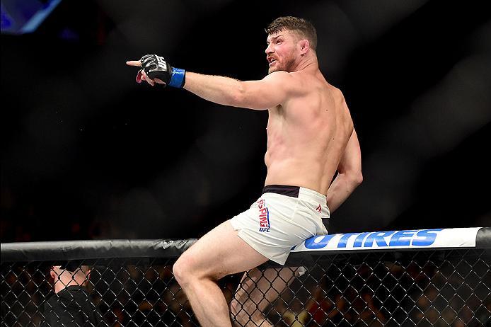INGLEWOOD, CA - JUNE 04: Michael Bisping of England celebrates after his first round knockout win against Luke Rockhold in their UFC middleweight championship bout during the UFC 199 event at The Forum on June 4, 2016 in Inglewood, California. (Photo by