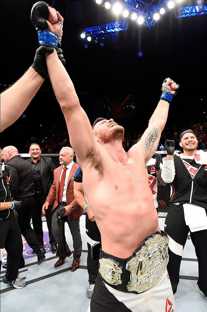 INGLEWOOD, CA - JUNE 04: Michael Bisping of England celebrates after his first round knockout win against Luke Rockhold in their UFC middleweight championship bout during the UFC 199 event at The Forum on June 4, 2016 in Inglewood, California. (Photo by