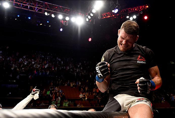 INGLEWOOD, CA - JUNE 04: Michael Bisping of England celebrates after his first round knockout win against Luke Rockhold in their UFC middleweight championship bout during the UFC 199 event at The Forum on June 4, 2016 in Inglewood, California. (Photo by