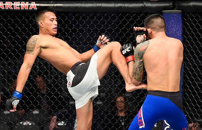 LAS VEGAS, NV - MARCH 04: (L-R) Andre Soukhamthath knees Albert Morales in their bantamweight bout during the UFC 209 event at T-Mobile Arena on March 4, 2017 in Las Vegas, Nevada. (Photo by Josh Hedges/Zuffa LLC/Zuffa LLC via Getty Images) *** Local Cap