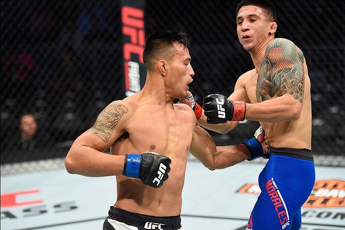 LAS VEGAS, NV - MARCH 04: (L-R) Andre Soukhamthath punches Albert Morales in their bantamweight bout during the UFC 209 event at T-Mobile Arena on March 4, 2017 in Las Vegas, Nevada. (Photo by Josh Hedges/Zuffa LLC/Zuffa LLC via Getty Images) *** Local C