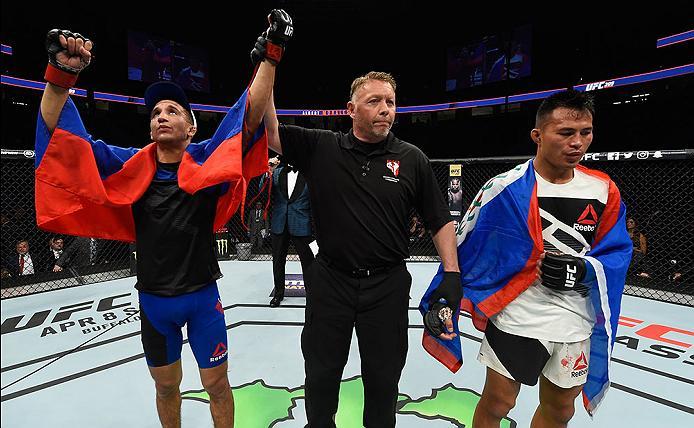LAS VEGAS, NV - MARCH 04: (left) Albert Morales reacts to his victory over Andre Soukhamthath (right) in their bantamweight bout during the UFC 209 event at T-Mobile Arena on March 4, 2017 in Las Vegas, Nevada. (Photo by Josh Hedges/Zuffa LLC/Zuffa LLC v