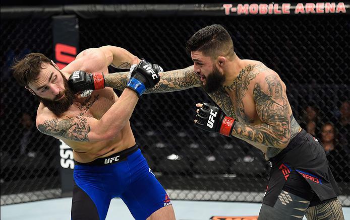 LAS VEGAS, NV - MARCH 04: (R-L) Tyson Pedro of Australia punches Paul Craig of Scotland in their light heavyweight bout during the UFC 209 event at T-Mobile Arena on March 4, 2017 in Las Vegas, Nevada. (Photo by Josh Hedges/Zuffa LLC/Zuffa LLC via Getty