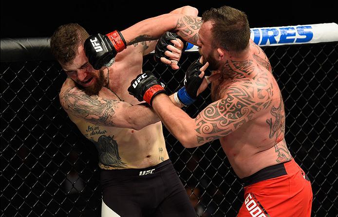 LAS VEGAS, NV - MARCH 04: (R-L) Mark Godbeer of England punches Daniel Spitz in their heavyweight bout during the UFC 209 event at T-Mobile Arena on March 4, 2017 in Las Vegas, Nevada. (Photo by Josh Hedges/Zuffa LLC/Zuffa LLC via Getty Images) *** Local