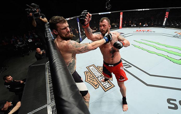 LAS VEGAS, NV - MARCH 04: (R-L) Mark Godbeer of England punches Daniel Spitz in their heavyweight bout during the UFC 209 event at T-Mobile Arena on March 4, 2017 in Las Vegas, Nevada. (Photo by Josh Hedges/Zuffa LLC/Zuffa LLC via Getty Images) *** Local