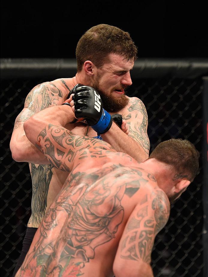 LAS VEGAS, NV - MARCH 04: Mark Godbeer of England (front) punches Daniel Spitz in their heavyweight bout during the UFC 209 event at T-Mobile Arena on March 4, 2017 in Las Vegas, Nevada. (Photo by Josh Hedges/Zuffa LLC/Zuffa LLC via Getty Images) *** Loc