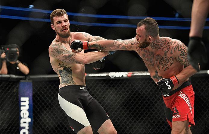 LAS VEGAS, NV - MARCH 04: (R-L) Mark Godbeer of England punches Daniel Spitz in their heavyweight bout during the UFC 209 event at T-Mobile Arena on March 4, 2017 in Las Vegas, Nevada. (Photo by Jeff Bottari/Zuffa LLC/Zuffa LLC via Getty Images) *** Loca
