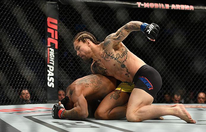 LAS VEGAS, NV - MARCH 04: Luke Sanders (top) punches Iuri Alcantara of Brazil in their bantamweight bout during the UFC 209 event at T-Mobile Arena on March 4, 2017 in Las Vegas, Nevada. (Photo by Jeff Bottari/Zuffa LLC/Zuffa LLC via Getty Images) *** L