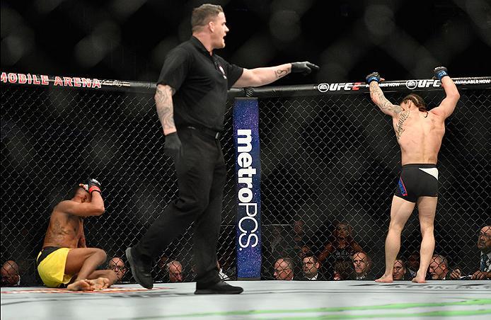 LAS VEGAS, NV - MARCH 04: Iuri Alcantara of Brazil (left) recovers in the corner after an illegal blow by Luke Sanders (right) in their bantamweight bout during the UFC 209 event at T-Mobile Arena on March 4, 2017 in Las Vegas, Nevada. (Photo by Jeff Bot