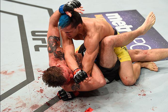 LAS VEGAS, NV - MARCH 04: Mirsad Bektic of Bosnia (top) punches Darren Elkins in their featherweight bout during the UFC 209 event at T-Mobile Arena on March 4, 2017 in Las Vegas, Nevada. (Photo by Josh Hedges/Zuffa LLC/Zuffa LLC via Getty Images) *** Lo