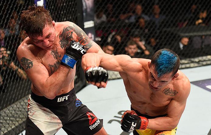 LAS VEGAS, NV - MARCH 04: (R-L) Mirsad Bektic of Bosnia punches Darren Elkins in their featherweight bout during the UFC 209 event at T-Mobile Arena on March 4, 2017 in Las Vegas, Nevada. (Photo by Josh Hedges/Zuffa LLC/Zuffa LLC via Getty Images) *** Lo
