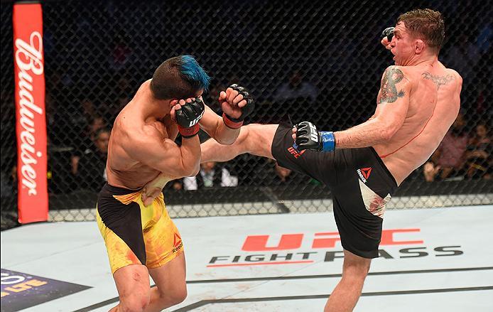LAS VEGAS, NV - MARCH 04: (R-L) Darren Elkins kicks Mirsad Bektic of Bosnia in their featherweight bout during the UFC 209 event at T-Mobile Arena on March 4, 2017 in Las Vegas, Nevada. (Photo by Josh Hedges/Zuffa LLC/Zuffa LLC via Getty Images) *** Loca
