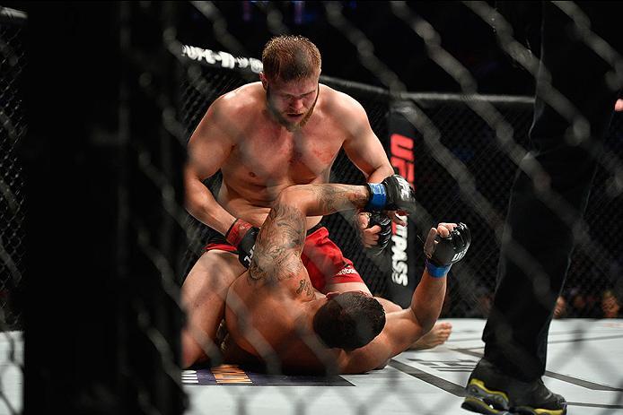 LAS VEGAS, NV - MARCH 04: Marcin Tybura of Poland (top) punches Luis Henrique of Brazil in their heavyweight bout during the UFC 209 event at T-Mobile Arena on March 4, 2017 in Las Vegas, Nevada. (Photo by Jeff Bottari/Zuffa LLC/Zuffa LLC via Getty Image