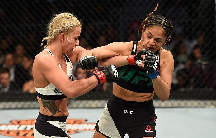 LAS VEGAS, NV - MARCH 04: (L-R) Amanda Cooper punches Cynthia Calvillo in their women's strawweight bout during the UFC 209 event at T-Mobile Arena on March 4, 2017 in Las Vegas, Nevada. (Photo by Josh Hedges/Zuffa LLC/Zuffa LLC via Getty Images) *** Loc