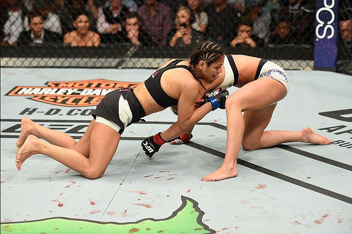 LAS VEGAS, NV - MARCH 04: Cynthia Calvillo (left) attempts to submit Amanda Cooper in their women's strawweight bout during the UFC 209 event at T-Mobile Arena on March 4, 2017 in Las Vegas, Nevada. (Photo by Josh Hedges/Zuffa LLC/Zuffa LLC via Getty Ima