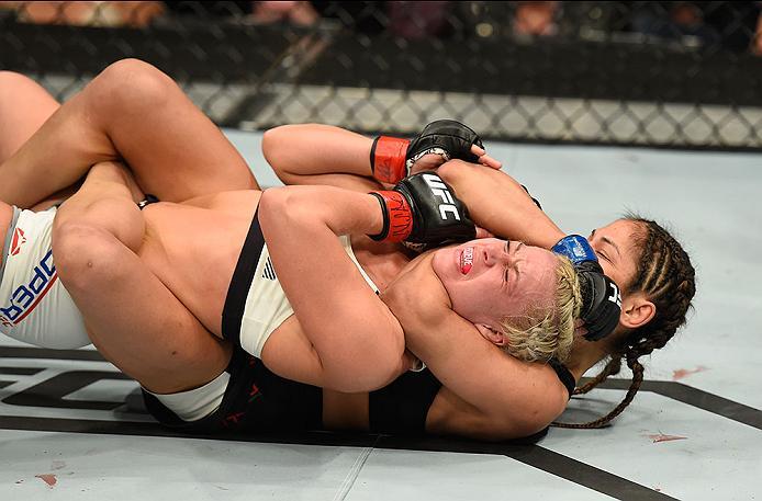 LAS VEGAS, NV - MARCH 04: Cynthia Calvillo (black) attempts to submit Amanda Cooper in their women's strawweight bout during the UFC 209 event at T-Mobile Arena on March 4, 2017 in Las Vegas, Nevada. (Photo by Josh Hedges/Zuffa LLC/Zuffa LLC via Getty I