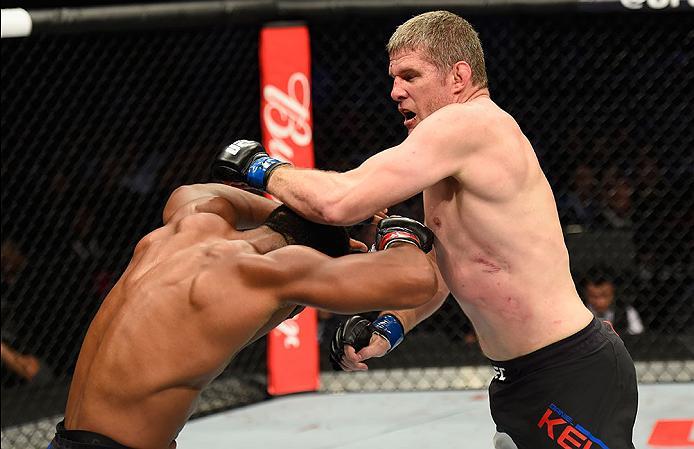 LAS VEGAS, NV - MARCH 04: (R-L) Daniel Kelly of Australia punches Rashad Evans in their middleweight bout during the UFC 209 event at T-Mobile Arena on March 4, 2017 in Las Vegas, Nevada. (Photo by Josh Hedges/Zuffa LLC/Zuffa LLC via Getty Images) *** Lo