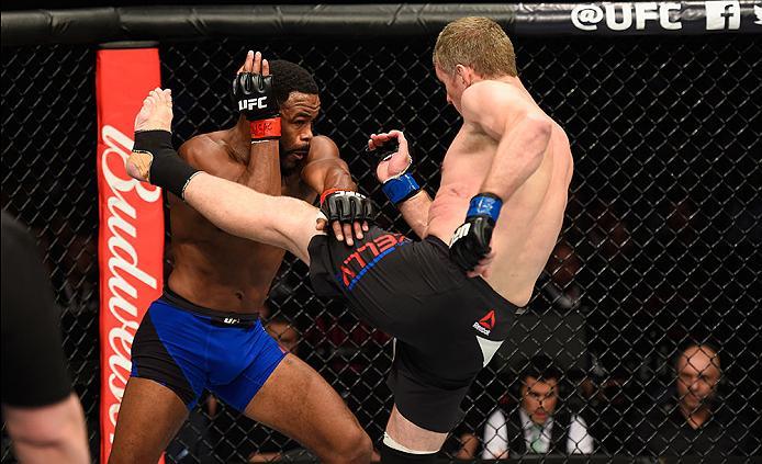 LAS VEGAS, NV - MARCH 04: (R-L) Daniel Kelly of Australia kicks Rashad Evans in their middleweight bout during the UFC 209 event at T-Mobile Arena on March 4, 2017 in Las Vegas, Nevada. (Photo by Josh Hedges/Zuffa LLC/Zuffa LLC via Getty Images) *** Loca