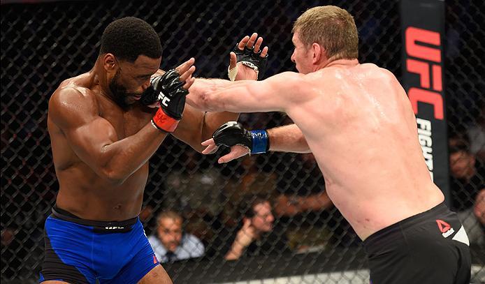LAS VEGAS, NV - MARCH 04: (R-L) Daniel Kelly of Australia punches Rashad Evans in their middleweight bout during the UFC 209 event at T-Mobile Arena on March 4, 2017 in Las Vegas, Nevada. (Photo by Josh Hedges/Zuffa LLC/Zuffa LLC via Getty Images) *** Lo