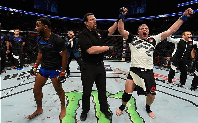 LAS VEGAS, NV - MARCH 04: Daniel Kelly of Australia (right) reacts to his victory over Rashad Evans (left) in their middleweight bout during the UFC 209 event at T-Mobile Arena on March 4, 2017 in Las Vegas, Nevada. (Photo by Josh Hedges/Zuffa LLC/Zuffa