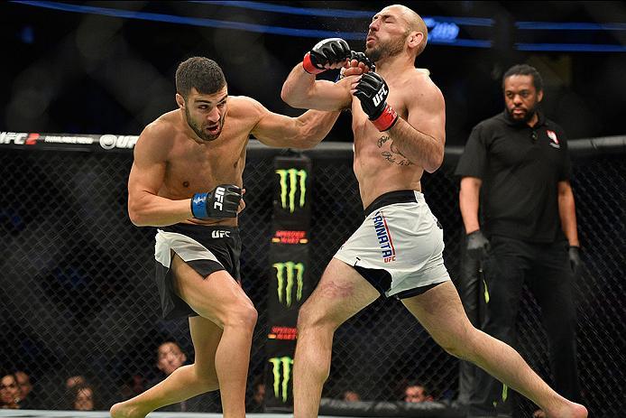 LAS VEGAS, NV - MARCH 04: (L-R) David Teymur of Sweden punches Lando Vannata in their lightweight bout during the UFC 209 event at T-Mobile Arena on March 4, 2017 in Las Vegas, Nevada. (Photo by Jeff Bottari/Zuffa LLC/Zuffa LLC via Getty Images) *** Loca