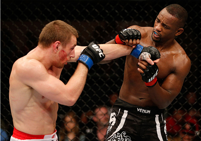 ALBUQUERQUE, NM - JUNE 07: (L-R) Piotr Hallmann punches Yves Edwards in their lightweight fight during the UFC Fight Night event at Tingley Coliseum on June 7, 2014 in Albuquerque, New Mexico. (Photo by Josh Hedges/Zuffa LLC/Zuffa LLC via Getty Images)