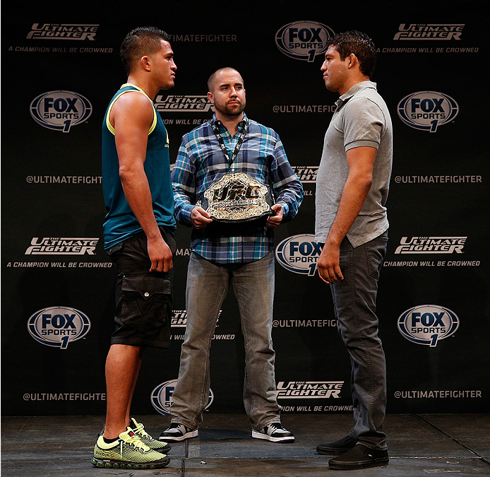 LAS VEGAS, NV - JULY 03: (L-R) UFC lightweight champion Anthony Pettis and upcoming opponent Gilbert Melendez face off during the UFC Ultimate Media Day at the Mandalay Bay Resort and Casino on July 3, 2014 in Las Vegas, Nevada. (Photo by Josh Hedges/Zu