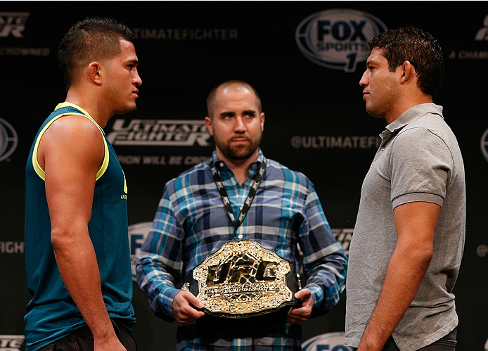 LAS VEGAS, NV - JULY 03: (L-R) UFC lightweight champion Anthony Pettis and upcoming opponent Gilbert Melendez face off during the UFC Ultimate Media Day at the Mandalay Bay Resort and Casino on July 3, 2014 in Las Vegas, Nevada. (Photo by Josh Hedges/Zu