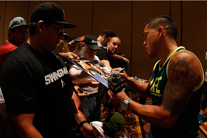 LAS VEGAS, NV - JULY 03: UFC lightweight champion Anthony Pettis signs autographs during the UFC Ultimate Media Day at the Mandalay Bay Resort and Casino on July 3, 2014 in Las Vegas, Nevada. (Photo by Josh Hedges/Zuffa LLC/Zuffa LLC via Getty Images)