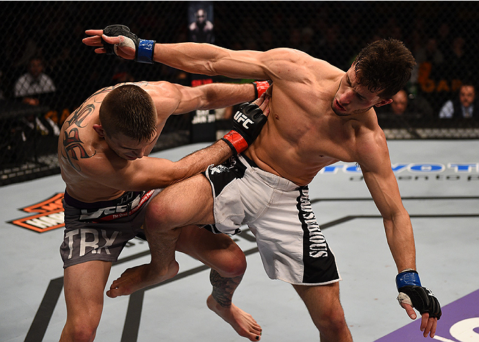 BOSTON, MA - JANUARY 18: (R-L) Frankie Perez kicks Johnny Case in their lightweight fight during the UFC Fight Night event at the TD Garden on January 18, 2015 in Boston, Massachusetts. (Photo by Jeff Bottari/Zuffa LLC/Zuffa LLC via Getty Images)