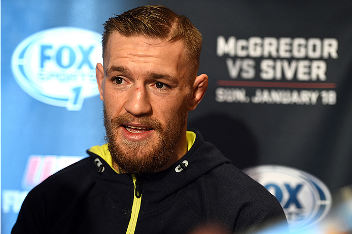 BOSTON, MA - JANUARY 16: UFC featherweight Conor McGregor of Ireland interacts with media at Faneuil Hall on January 16, 2015 in Boston, Massachusetts. (Photo by Jeff Bottari/Zuffa LLC/Zuffa LLC via Getty Images)