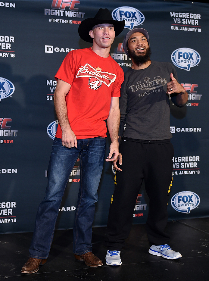 BOSTON, MA - JANUARY 16: (L-R) UFC lightweights Donald 'Cowboy' Cerrone and Benson 'Smooth' Henderson interact with the media at Faneuil Hall on January 16, 2015 in Boston, Massachusetts. (Photo by Jeff Bottari/Zuffa LLC/Zuffa LLC via Getty Images)