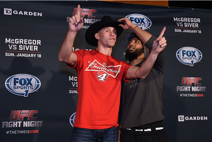 BOSTON, MA - JANUARY 16: (L-R) UFC lightweights Donald 'Cowboy' Cerrone and Benson 'Smooth' Henderson interact with the media at Faneuil Hall on January 16, 2015 in Boston, Massachusetts. (Photo by Jeff Bottari/Zuffa LLC/Zuffa LLC via Getty Images)