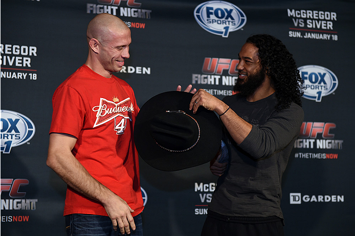 BOSTON, MA - JANUARY 16: (L-R) UFC lightweights Donald 'Cowboy' Cerrone and Benson 'Smooth' Henderson interact with the media at Faneuil Hall on January 16, 2015 in Boston, Massachusetts. (Photo by Jeff Bottari/Zuffa LLC/Zuffa LLC via Getty Images)